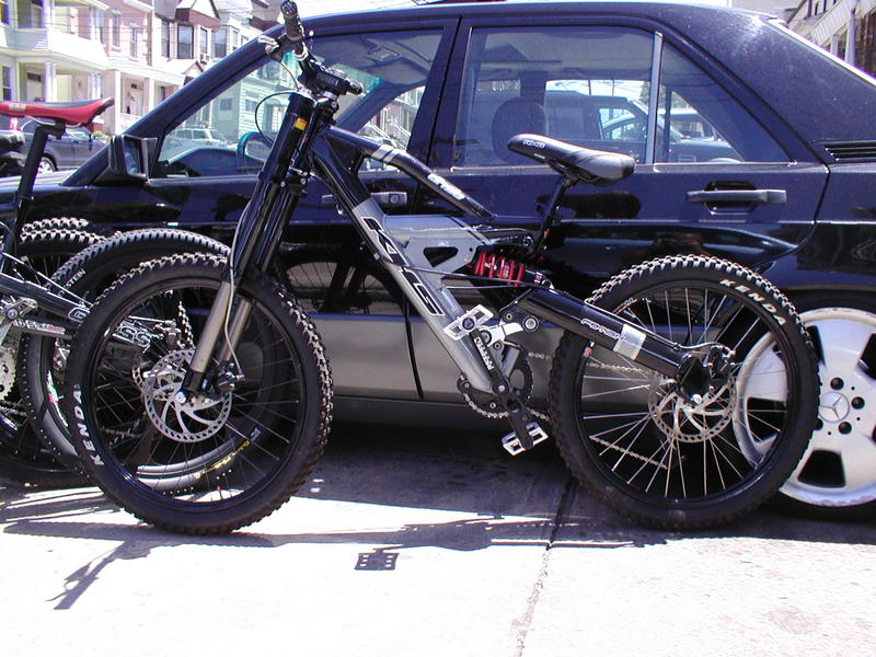 03' KHS Fetish 50DH

Bombshell Carbon proto fork 7" 
Romic 7" pushed travel upped from 6"
SRAM drive
Raceface NS cranks
Blackspire guides
Sun Double wides 24"
Hayes Mags