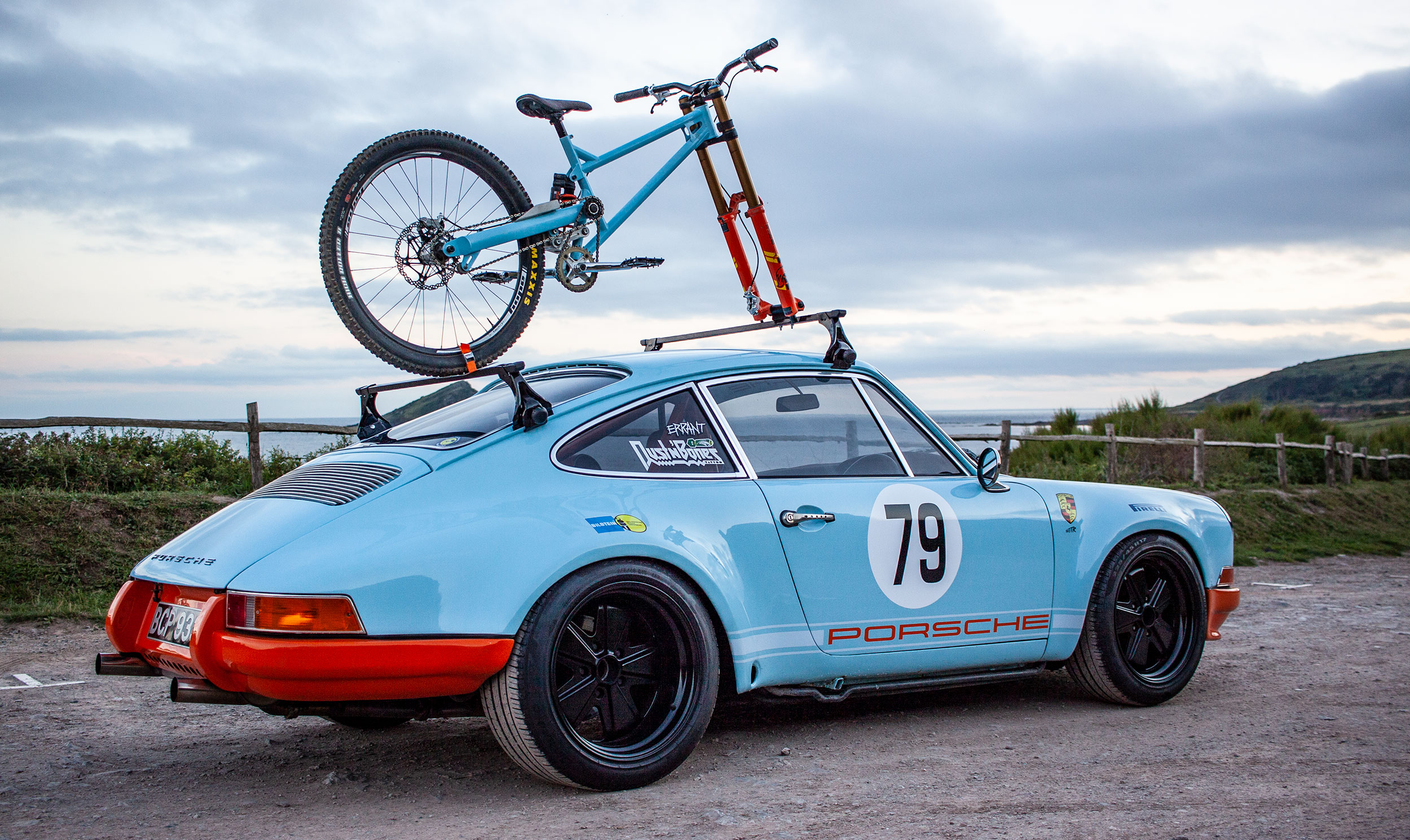 Porche-with-Tora-Bike-on-the-roof.jpeg