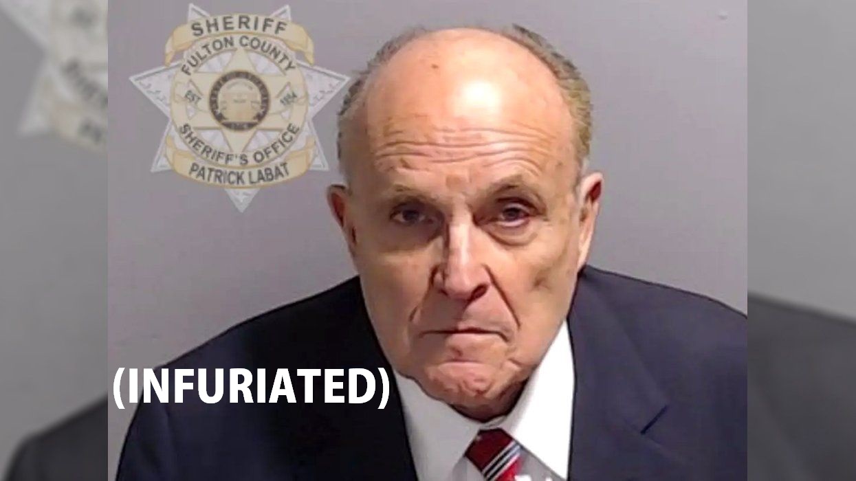 rudy-giuliani-turns-himself-in-poses-for-mugshot-2280636463.jpg