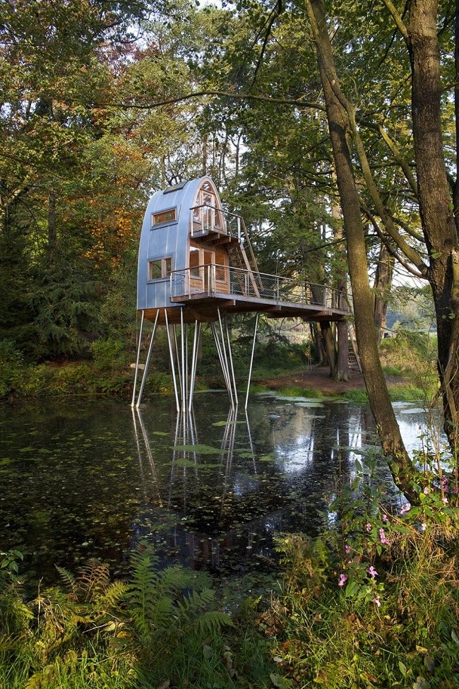 unusual-forest-cabin-on-stilts-over-pond-2-far-angle.jpg
